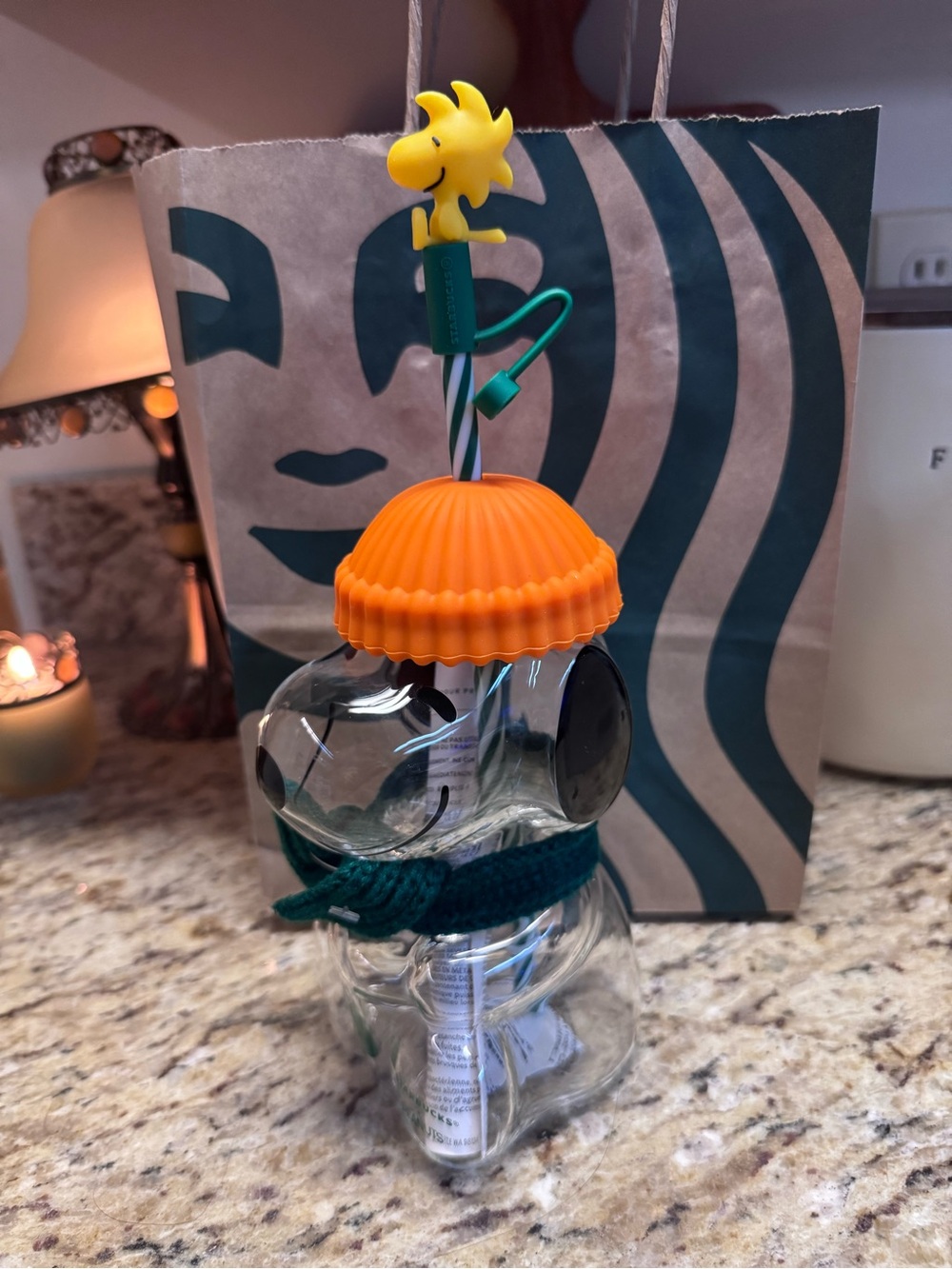 Starbucks Orange Hat Glass Bottle with Yellow Woodstock Topper and Green Strap